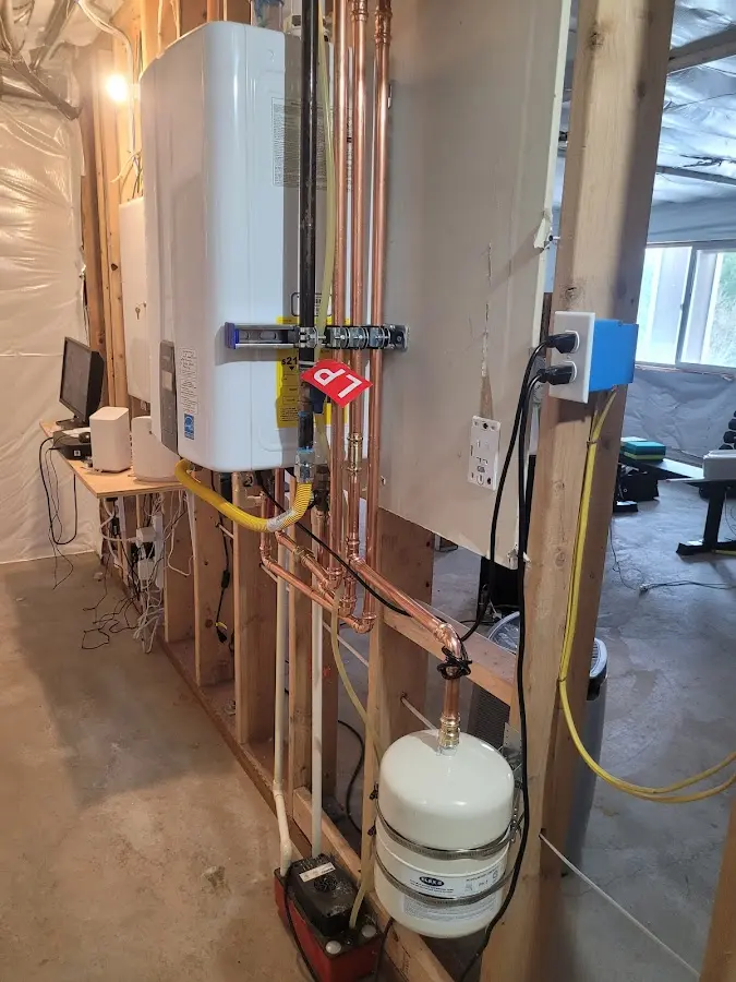 Licensed plumber repairing a kitchen sink in Canton